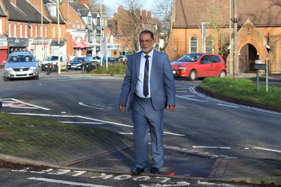 Cllr Abul Koher Chowdhury trying to cross Lynchford Road at St. Alban’s roundabout